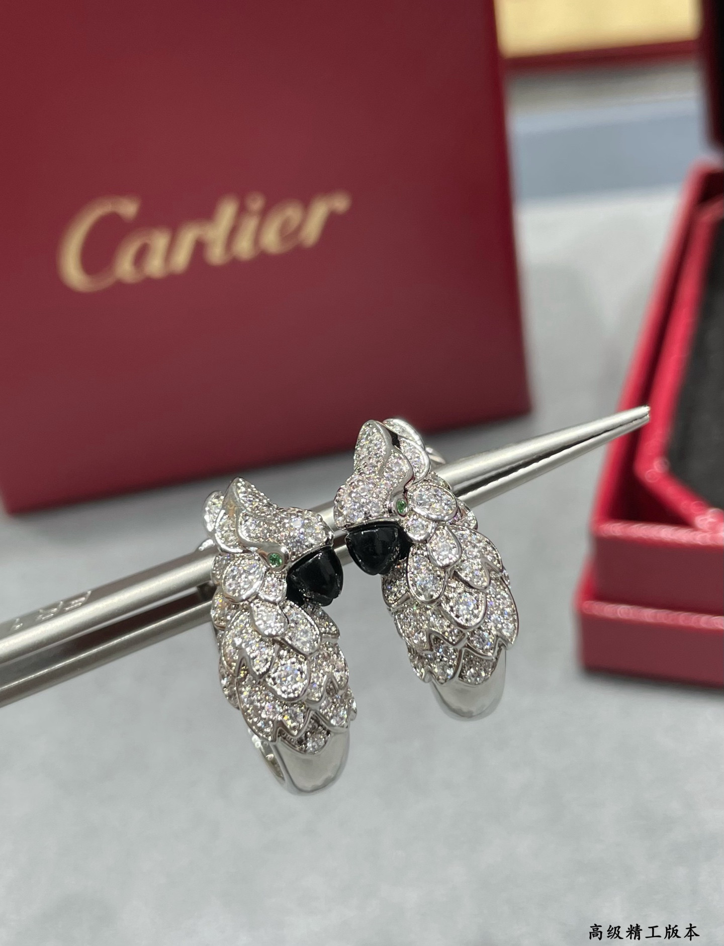 Ca*t1er Parrot Earrings