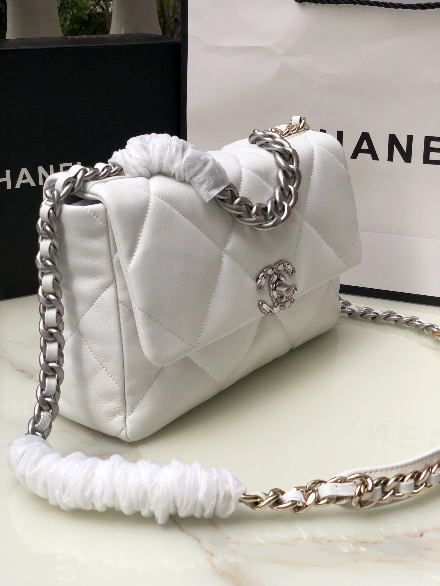 Ch**el 19 LARGE HANDBAG Shiny Leather, Gold-Tone, Silver-Tone & Ruthenium-Finish Metal White 7.8 × 11.7 × 3.9 in