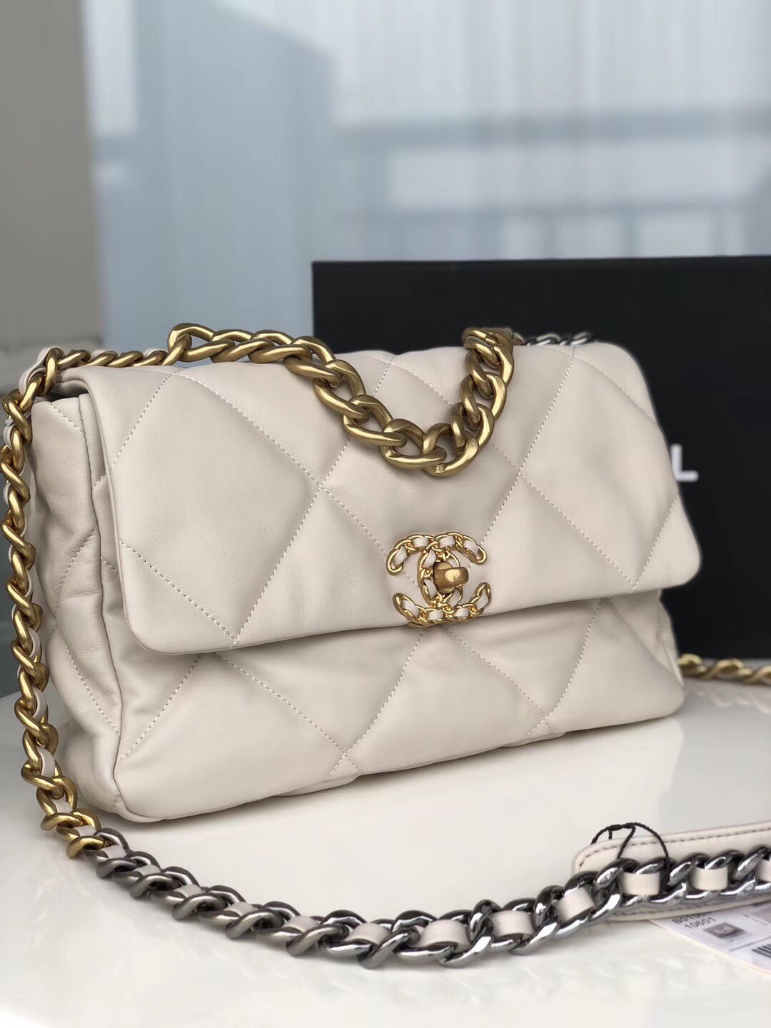 Ch**el 19 LARGE HANDBAG Shiny Leather, Gold-Tone, Silver-Tone & Ruthenium-Finish Metal Beige 7.8 × 11.7 × 3.9 in